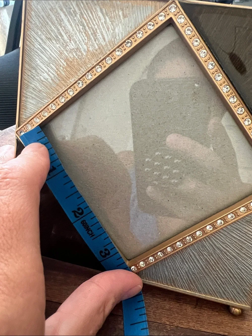 Z Gallerie picture frame features an enamel and crystal-decorated diamond border